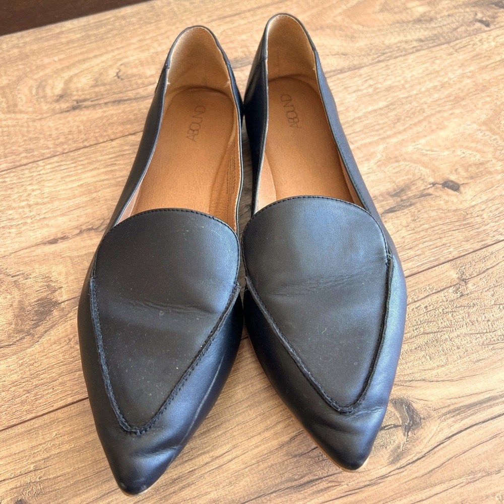 Flat black leather shoes